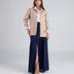 Chaqueta tipo parka caqui con bordado Aquí Florezco para mujer – Juliana Sanchez | Casa Precis, Concept Store. Primer plano.