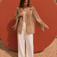 Chaqueta de cuero con flecos en color arena de la marca Reghio con botones forrados y diseño de autor – Chaqueta de lujo hecha en Colombia | Casa Precis, Concept Store