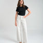 Pantalón recto blanco en dril con bordado Can't Stop Me para mujer – Juliana Sanchez | Casa Precis, Concept Store. Primer plano.
