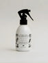 Perfume de ambiente antibacterial con aroma a Flor de Loto de la marca colombiana Gandha. Ideal para aromatizar y desinfectar textiles y espacios sociales con la sofisticación del diseño local.