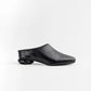 Botín Yuval de Javier Jiménez en cuero negro con diseño de tiras entrelazadas y hebilla – Calzado colombiano de lujo | Casa Precis, Concept Store