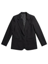 Twiggy Blazer de la marca Décadas en color negro con detalle posterior abullonado en cuero sintético y bordado de flor blanca – Blazer sastrero de diseño de autor hecho en Colombia | Casa Precis, Concept Store