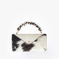Cartera tipo Sobre Nopal de la marca Celestino confeccionada en cuero con pelo natural – Marroquinería de lujo artesanal y accesorios de mano de diseño colombiano | Casa Precis, Concept Store