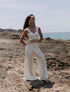 Pantalón Alma de la marca Bianco en color neutro con silueta fluida y tiro alto – Pantalón de lujo y diseño de autor hecho en Colombia | Casa Precis, Concept Store