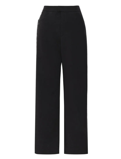 Greta Pants de la marca Décadas de tiro alto y bota ancha con detalle de flor en alto relieve tridimensional – Pantalón sastrero de lujo hecho en Colombia | Casa Precis, Concept Store
