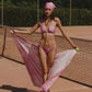 Pareo de playa Bandana Pink Beach Wrap de la marca Flor Amazona con estampado gráfico verde de diseño de autor multifuncional – Ropa de playa de lujo hecha en Colombia | Casa Precis, Concept Store