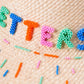 Sombrero Letters from Summer de la marca SerSer con diseño de autor estival y ala ancha estructurada para el sol – Sombrero de lujo artesanal hecho en Colombia | Casa Precis, Concept Store